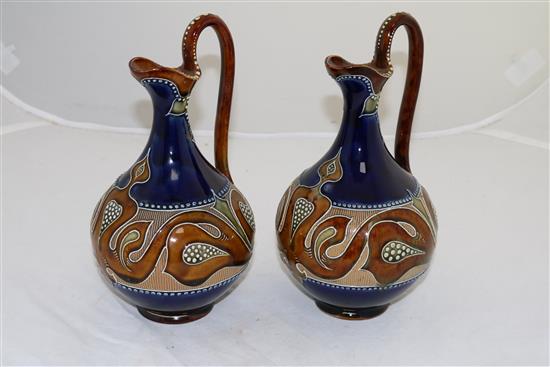 A pair of Doulton Lambeth Art Nouveau stoneware ewers, by Frank A Butler, c.1900, height 24cm (9.5in.)